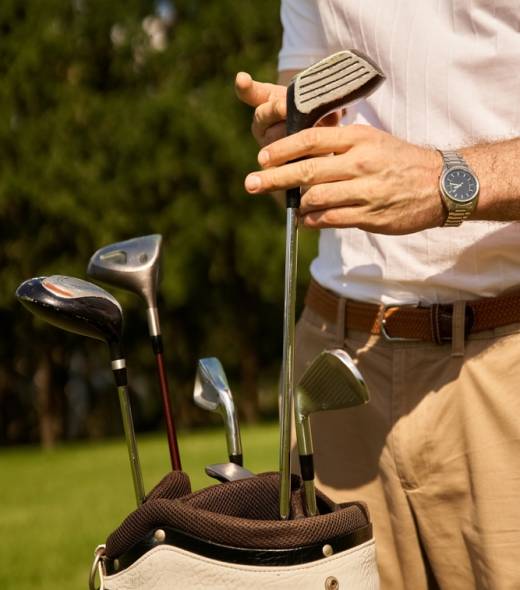 A,Stylish,Young,Man,Wearing,Elegant,Clothing,,Putting,His,Golf